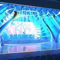 Vibrant Stage Design With Blue Lighting Curved Structures And Auditorium Seats 3d model