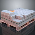 Stacked Gray Bricks on Wooden Pallet with Green Straps and Orange Label