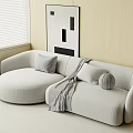 Light Gray Curved Sectional Sofa With Cushions Throw Blanket And Abstract Painting In Modern Room