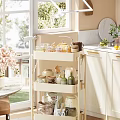 Bright Kitchen Interior With White Cabinets Three Tier Cart And Marble Countertop
