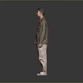 Man in brown shirt white undershirt khaki pants beige shoes against gray black gradient background