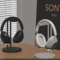 Sony XM5 Headphones Black And White On Stands Table