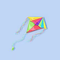 Colorful Diamond Shaped Kite With Streamers On Light Blue Background