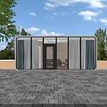 Modern Guesthouse Building With Large Glass Windows Paved Stone Courtyard And Lush Green Trees