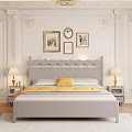 Light Gray Double Bed with Yellow Blanket White Pillows Table Lamps and Decorative Columns