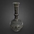 Antique Carved Metal Vase With Intricate Floral Patterns And Ornate Design