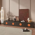 Dark Wood TV Stand With Orange Circular Accents And Vase Lamp Artwork Against Beige Wall