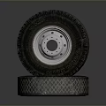 Stacked Tires With Diamond Pattern Tread And White Metal Rims 3d model