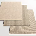 Neutral Toned Square Rugs with Smooth and Striped Textures Stacked Together