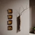 Rustic Wall Decor with Wooden Decorative Blocks and Branch on Gray Textured Wall