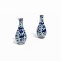 Pair of Blue and White Vases with Intricate Floral Patterns and Classic Design