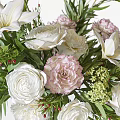 Elegant Floral Arrangement In Clear Glass Vase With White Roses Pink Blooms And Green Foliage