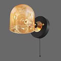 Modern Wall Lamp Featuring Amber Glass Shade Gold Metal And Black Base Design