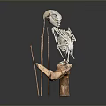 Skeleton Model Supported By Sticks On Rock Like Base Against Dark Background 3d model