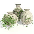 Three Light Colored Woven Vases With Green Vines For Indoor Decoration