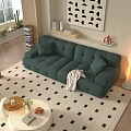 Green Tufted Two Seater Sofa With White Round Coffee Table And Geometric Rug