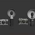 Vintage Electronic Cameras With Large Flash Units And Reflective Surfaces