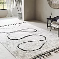 Modern White Square Rug With Black Curved Patterns And Tassels In Living Room