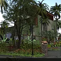 Tropical Detached Villa Surrounded by Palm Trees Lush Greenery and Flower Garden