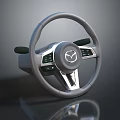 Gray Modern Car Steering Wheel With Mazda Logo Control Buttons And Silver Accents