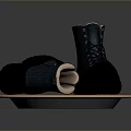 Black And Blue Lace Up Boots With Light Lining On Round Metal Edge Tray
