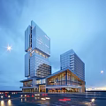 Modern High Rise Office Building With Glass Curtain Wall And Night Lighting
