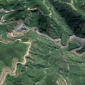 Aerial View Of Winding Mountain Roads In Lush Green Mountain Ranges