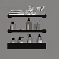 Bathroom Accessories Organized on Black Wall Mounted Shelves With Rolled Towels Bottles and Toothbrush Holders