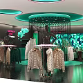 Stylish Fashion Clothing Store Interior With Green Lighting Clothing Displays And Decorative Backdrops