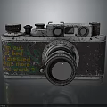 Vintage Electronic Camera Featuring Classic Lens Engraved Text and Retro Surface Design 3d model