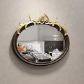 Elegant Oval Bedroom Mirror With Golden Decorative Frame Reflecting Bed And Pillows