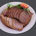 Delicious Sliced Braised Meat Served On White Plate With Green Leaves And Red Carrot Strips