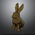 Golden Rabbit Statue In Sitting Position With Shiny Metallic Finish Against Dark Background