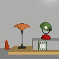 Orange Mushroom and Green Helmet Style Table Lamps with Silver Red Bases on Colorful Stands