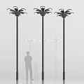 Three Black Pole Outdoor Lights With Flower Shaped Design And Human Silhouette
