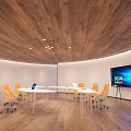 Modern Conference Room With Circular Wooden Ceiling White Table Orange Rolling Chairs And Large Screen