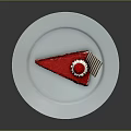 Red Velvet Cake Slice With Cream Layers And Red Topping On White Plate