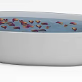 White Bathtub Filled With Water And Floating Red Orange Rose Petals