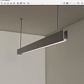 Modern Long Linear Pendant Light With Sleek Metal Frame Hanging In White Room