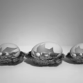 Three Decorative Eggs in Woven Nests with Gray White Shells and Gold Stars Inside
