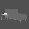Light Gray Chaise Lounge With Wooden Side Table And Stack Of Books