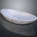 Gray Oval Textured Washbasin with Granular Surface and Reflective Base for Modern Bathroom Design
