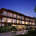 Modern Multilevel Townhouse With Illuminated Windows Landscaped Gardens Pathway And Warm Ambiance