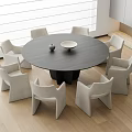 Modern Round Dark Gray Dining Table Set with Six Light Colored Chairs and Minimalist Decor