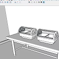 Restaurant Buffet Setup With Two Stainless Steel Food Warmers On White Table