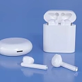 White Wireless Earbuds with Open and Closed Charging Case on Blue Background 3d model