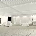 Modern Exhibition Hall Interior With White Sculptures And Human Figures