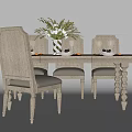 Wooden Dining Table Set With Light Tone Chairs Green Plant And Tableware