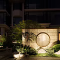Traditional Chinese Garden Landscape with Rockery Waterfall Circular Window Stone Wall and Green Plants