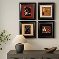 Four Framed Abstract Paintings on Wall with Table Lamp and Plant Decor